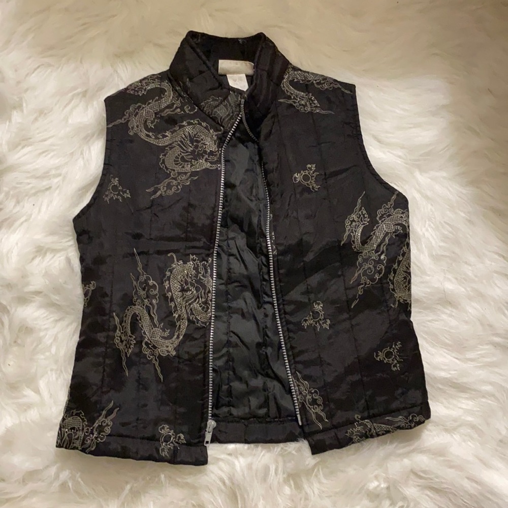 Black zip up no sleeve vest with dragon patterns